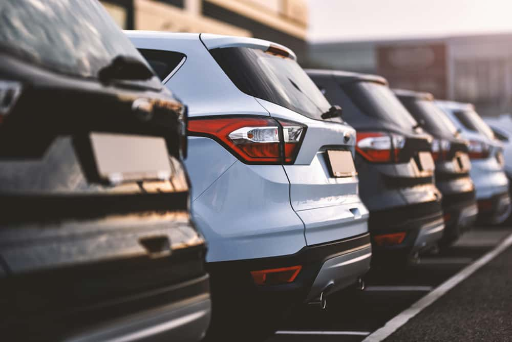 cars parked in row on outdoor parking